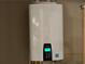 Modern Navien water heater displaying 128°F, ensuring efficient home system at 187 Slate Dr, Buford, GA 30518