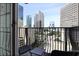 Apartment balcony with seating area and views of downtown skyline at 195 14Th St # 1403, Atlanta, GA 30309
