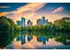 Beautiful cityscape view featuring a lake and sunset reflecting on the buildings at 195 14Th St # 1403, Atlanta, GA 30309