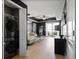Modern living space featuring neutral walls, laminate floors, and a private balcony at 195 14Th St # 1403, Atlanta, GA 30309