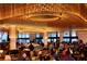 Interior view of a restaurant with an ornate, illuminated ceiling and people at tables at 195 14Th St # 1403, Atlanta, GA 30309