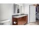 This bathroom features a granite vanity, a toilet, and a door to a walk-in closet at 250 Pharr Ne Rd # 1113, Atlanta, GA 30305
