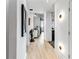 Bright hallway with wood floors, decor, and modern lighting at 250 Pharr Ne Rd # 1113, Atlanta, GA 30305