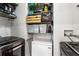 Functional laundry room with modern washer, dryer, and shelving for organized storage solutions at 250 Pharr Ne Rd # 1113, Atlanta, GA 30305