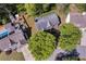 An aerial view displays a well-maintained home surrounded by lush landscaping and neighboring properties at 4095 Fastnet Ln, Duluth, GA 30096