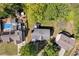 An aerial view showcases the home, its roof, backyard, and location amidst mature trees and adjacent properties at 4095 Fastnet Ln, Duluth, GA 30096