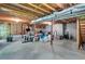 Unfinished basement with concrete floors and exposed ceiling with organized storage at 4095 Fastnet Ln, Duluth, GA 30096