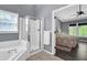 Bathroom featuring a glass shower with a view into a bedroom at 4095 Fastnet Ln, Duluth, GA 30096