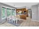 Bright dining area with large windows and a view to the kitchen at 4095 Fastnet Ln, Duluth, GA 30096