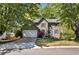 Charming two-story home with a well-manicured lawn, lush landscaping and a two-car garage at 4095 Fastnet Ln, Duluth, GA 30096