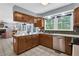 Functional kitchen with stainless steel appliances, ample counter space, and wooden cabinetry at 4095 Fastnet Ln, Duluth, GA 30096