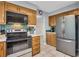 Cozy kitchen with tile backsplash and stainless steel refrigerator at 4095 Fastnet Ln, Duluth, GA 30096