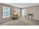 Bright living room with natural light, neutral carpet, and a welcoming atmosphere at 4095 Fastnet Ln, Duluth, GA 30096