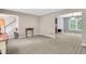 Open-concept living space with neutral tones and a view into the dining and entry areas at 4095 Fastnet Ln, Duluth, GA 30096