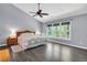 Main bedroom with vaulted ceilings, ensuite bathroom, and large windows at 4095 Fastnet Ln, Duluth, GA 30096