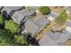 A top-down aerial view of the homes showcasing the property's roof, landscaping, and proximity to nearby streets at 4930 Kings Common Way, Cumming, GA 30040