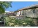 A serene backyard boasting a well-manicured lawn and a stone patio that overlooks the beautifully landscaped garden at 4930 Kings Common Way, Cumming, GA 30040