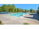 Large community swimming pool with plenty of lounge chairs perfect for relaxation and enjoying the sun at 4930 Kings Common Way, Cumming, GA 30040