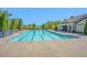 A well-maintained community pool surrounded by lush greenery, offering a refreshing and serene recreational space at 4930 Kings Common Way, Cumming, GA 30040