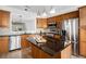 Modern kitchen featuring stainless steel appliances, granite countertops, and ample cabinet space at 4930 Kings Common Way, Cumming, GA 30040
