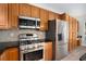 Well-equipped kitchen with stainless steel appliances and ample storage space at 4930 Kings Common Way, Cumming, GA 30040