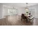 Spacious, open-concept living space features hardwood floors and plenty of natural light at 4930 Kings Common Way, Cumming, GA 30040