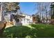Manicured backyard, deck with pergola, outdoor kitchen and seating area at 1205 Club Walk Ne Dr, Brookhaven, GA 30319