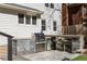 Built-in backyard grill with bar seating, stainless steel drawers, and mini fridge at 1205 Club Walk Ne Dr, Brookhaven, GA 30319