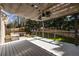 Outdoor deck and entertaining space with built-in grill, pergola, and ceiling fans at 1205 Club Walk Ne Dr, Brookhaven, GA 30319