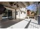 Outdoor deck with shaded pergola, built-in grill, and sliding glass door to home interior at 1205 Club Walk Ne Dr, Brookhaven, GA 30319