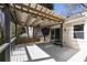 Outdoor deck and covered pergola with shade, looking to the fenced in backyard with a grill at 1205 Club Walk Ne Dr, Brookhaven, GA 30319