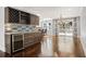 Stylish bar area with custom cabinetry, wine storage, and a view into the dining area at 1205 Club Walk Ne Dr, Brookhaven, GA 30319