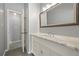 Bathroom featuring vanity with marble countertop, large mirror, and access to the toilet at 1205 Club Walk Ne Dr, Brookhaven, GA 30319
