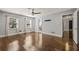 Large bedroom with hardwood floors, ceiling fan, and two windows at 1205 Club Walk Ne Dr, Brookhaven, GA 30319