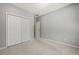 Bedroom featuring plush carpet, closet with large doors, and neutral walls at 1205 Club Walk Ne Dr, Brookhaven, GA 30319