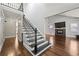 Elegant foyer featuring a staircase, hardwood flooring, and a glimpse into the living space at 1205 Club Walk Ne Dr, Brookhaven, GA 30319