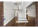 Inviting foyer with a staircase, hardwood floors, and a view into the living area at 1205 Club Walk Ne Dr, Brookhaven, GA 30319