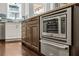 Kitchen island with built-in microwave and storage in a well-lit, open space at 1205 Club Walk Ne Dr, Brookhaven, GA 30319