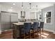 Kitchen featuring stainless steel appliances, island with seating, and modern pendant lighting at 1205 Club Walk Ne Dr, Brookhaven, GA 30319