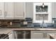 Kitchen area showcasing stainless steel appliances, countertops, and contemporary backsplash at 1205 Club Walk Ne Dr, Brookhaven, GA 30319