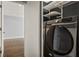 Laundry features Samsung washer and dryer along with some shelving at 1205 Club Walk Ne Dr, Brookhaven, GA 30319
