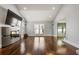 Expansive living room featuring hardwood floors, a fireplace, and abundant natural light at 1205 Club Walk Ne Dr, Brookhaven, GA 30319