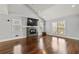 Bright living room with hardwood floors, a fireplace, large windows, and vaulted ceiling at 1205 Club Walk Ne Dr, Brookhaven, GA 30319