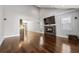 Spacious living room with hardwood floors, a modern fireplace, and ample natural light at 1205 Club Walk Ne Dr, Brookhaven, GA 30319