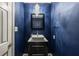 Stylish powder room featuring a square vessel sink, modern vanity, and elegant lighting fixture at 1205 Club Walk Ne Dr, Brookhaven, GA 30319
