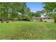 The large fenced back yard features free range chickens and space for outdoor living at 1217 Topaz Ln, Villa Rica, GA 30180