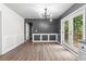 Dining area featuring modern lighting, wainscoting, and sliding doors to the outside at 1217 Topaz Ln, Villa Rica, GA 30180