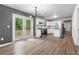 Open layout kitchen featuring modern appliances, white cabinets, and access to the backyard at 1217 Topaz Ln, Villa Rica, GA 30180