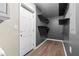 This spacious pantry features multiple shelves and wood-look flooring at 1217 Topaz Ln, Villa Rica, GA 30180