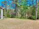 Large backyard with trees at 1673 Dover Creek Ln, Lawrenceville, GA 30045